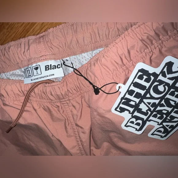 Black eye patch pink nylon cargo pants size small NWT